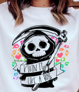 White shirt with bright cheetah print graphic with cute grim reaper and "killin it like a boss" quote