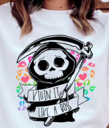 White shirt with bright cheetah print graphic with cute grim reaper and 
