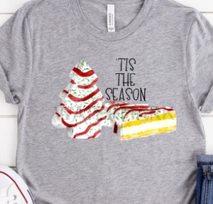 Grey t-shirt with "tis the season" quote and Little Debbie Christmas Tree Cakes graphic